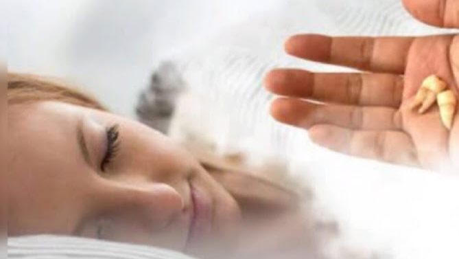 تفسير حلم سقوط الأسنان في اليد بدون ألم