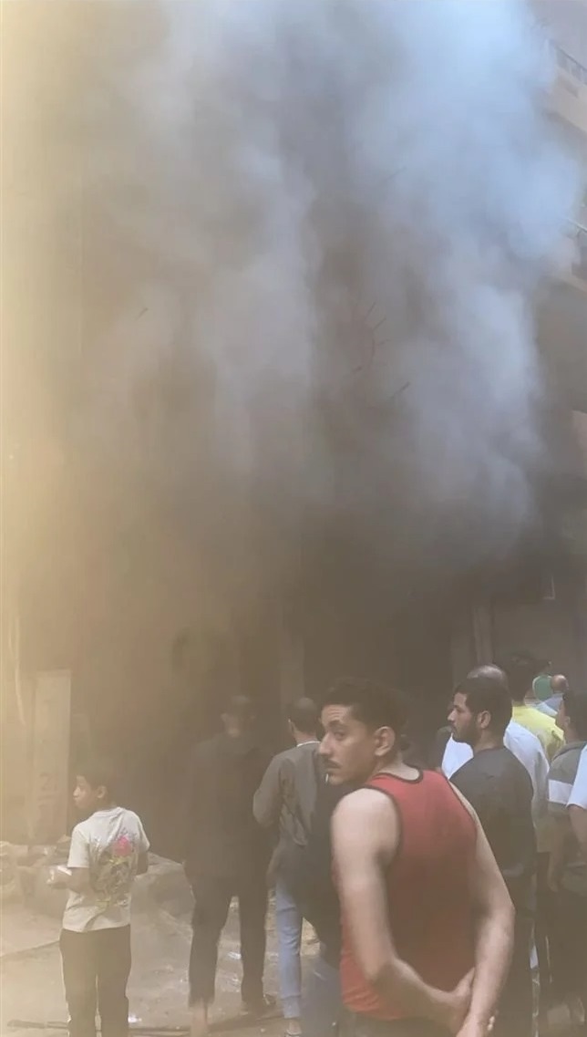 حريق محل ببرج سكني