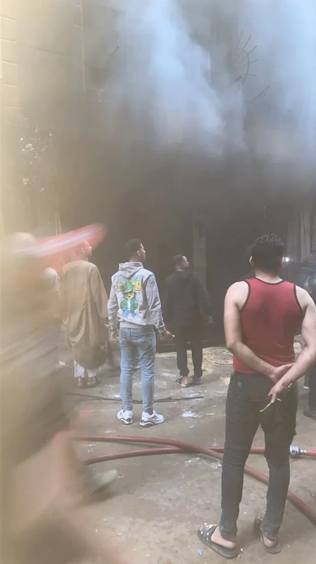 حريق محل ببرج سكني