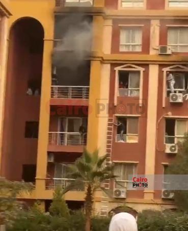 احتجاز أسرة في حريق شقة سكنية بكمبوند بأكتوبر