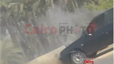 السيطرة على حريق اشتعل في سيارة أعلى محور 26 يوليو | صور