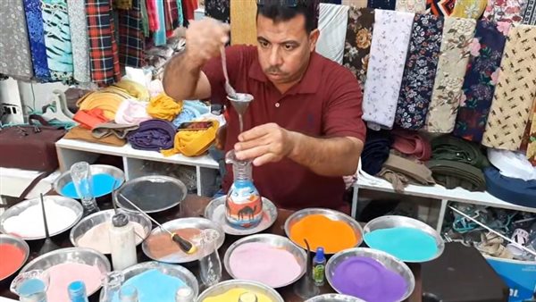 الرسم بالرمال داخل