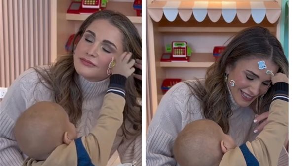 الملكة رانيا مع الطفل