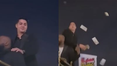 بيرمي الفلوس على الجمهور.. عنبة يحتفل بطرح أول أعماله السينمائية على طريقته الخاصة | فيديو