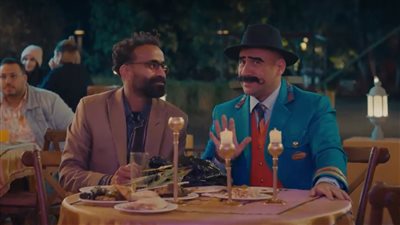 مسلسل الكبير أوي 8 الحلقة 29| جوني ينظم فقرات ترفيهية للنزلاء في المزاريطة.. وسفير أميجوس ينجو من الاغتيال