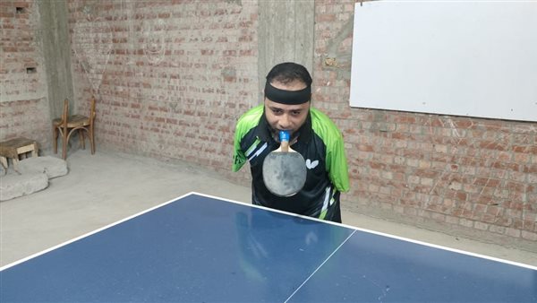 رضا أثناء اللعب تنس