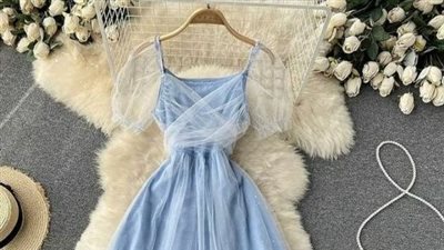 فساتين سهرة قصيرة فخمة للمراهقات.. طريقة تنسيقه مع البوط والمعطف في الشتاء