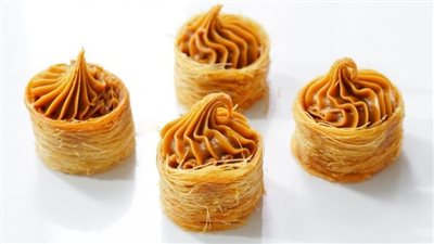 طريقة عمل عش البلبل السوري.. الوصفة الأصلية بالكنافة وأخرى بالجلاش 