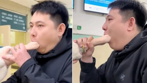 امرأة تعلق يدها بفم