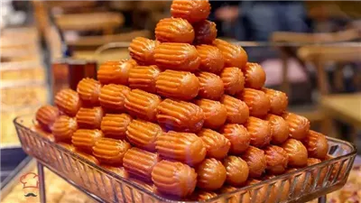 زي المحلات.. طريقة عمل بلح الشام المقرمش بالنشا بوصفة سحرية