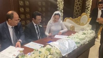 الصور الأولى من عقد قران الإعلامي محمد سعيد محفوظ على الدكتورة مها فتحي