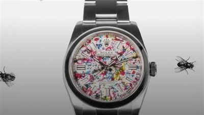 ساعة رولكس ملونة بقيء الذباب    