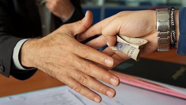 رشوة - تعبيرية