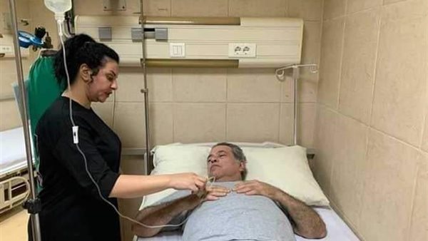 توفيق عكاشة وزوجته