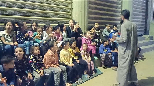 الشيخ رضا مع أطفال