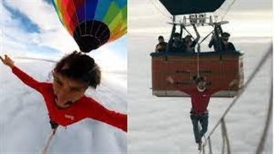 رجل يمشي على حبل بين منطقتين من الهواء الساخن محطمًا الرقم القياسي العالمي