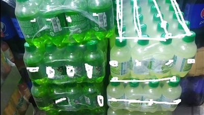 ضبط 450 زجاجة مياه غازية مجهولة المصدر قبل بيعها للمواطنين ببورسعيد | صور 