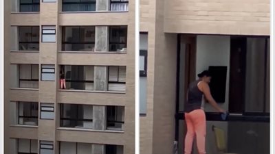 قلق وصدمة بين رواد التواصل الاجتماعي.. امرأة تنظف النوافذ من حافة مبنى شاهق │ فيديو